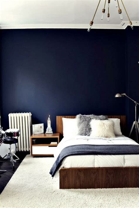 dark blue wall in bedroom.